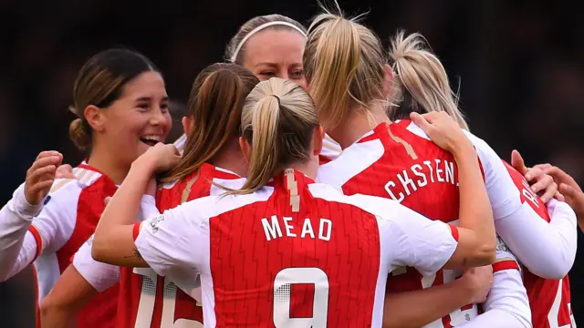 Stina Blackstenius of Arsenal celebrates with team mates after scoring at Brighton