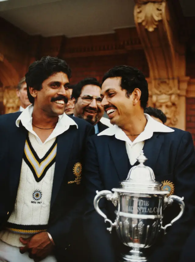 India players Kapil Dev (l) and Man of the Match Mohinder Amarnath pictured with the trophy after the 1983 Prudential World Cup Final victory against West Indies at Lords on June 25, 1983 in London, England.