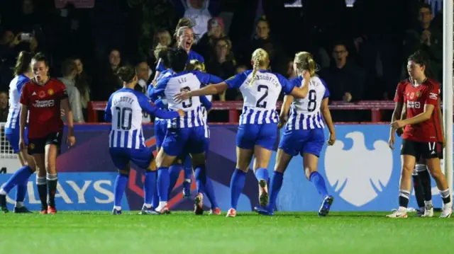 Brighton players celebrating a WSL goal