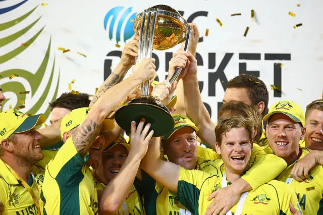 The Australia team cheer as they lift the world cup trophy as they celebrate victory during the 2015 ICC Cricket World Cup final match between Australia and New Zealand at Melbourne Cricket Ground on March 29, 2015 in Melbourne, Australia.