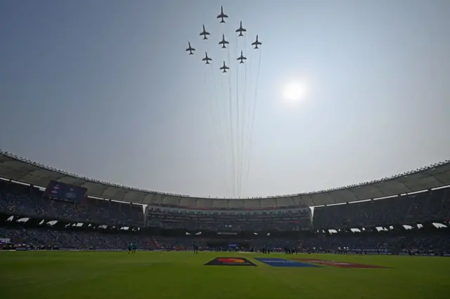 The Indian Air Force (IAF) Surya Kiran aerobatics team performs before the start of the 2023 ICC Men's Cricket World Cup one-day international (ODI) final match between India and Australia at the Narendra Modi Stadium in Ahmedabad on November 19, 2023.