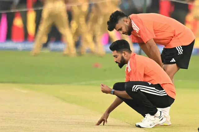 Mohammed Siraj and Shardul Thakur of India look at the pitch during a nets session at Narendra Modi Stadium