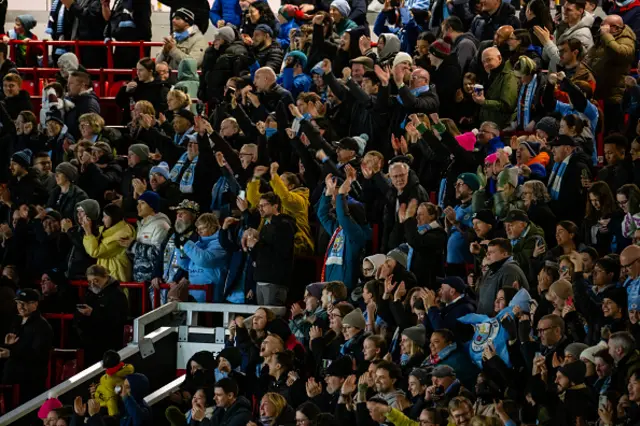 Manchester United city fans watch from the stands