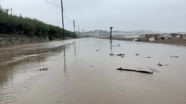 water flooding over the promenade