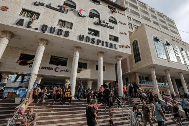 Palestinian families who fled their homes gather at the Al-Quds hospital following Israeli airstrikes on Tel al-Hawa neighborhood in Gaza City