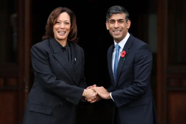 Britain's Prime Minister Rishi Sunak (R) welcomes US Vice President Kamala Harris (L) to the UK Artificial Intelligence (AI) Safety Summit at Bletchley Park, in central England, on November 2, 2023.