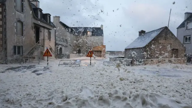 This photograph shows foam in the street of Penmarc'h, western France, on November 2, 2023, as the storm Ciaran hits the region.