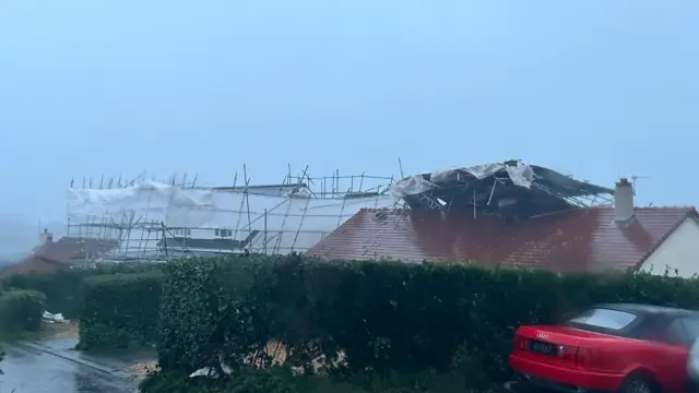 Damaged scaffolding on top of a house in St Saviours, Guernsey