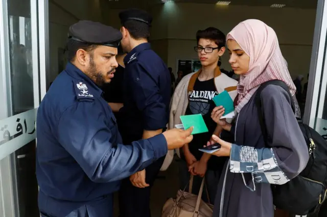 A woman leaving Gaza with a foreign passport on Thursday