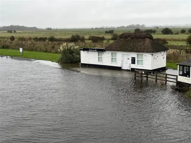 The River Bure is about an inch or two from the door of the Dunes River Café at Acle Bridge