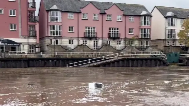 Fridge floating in River Exe