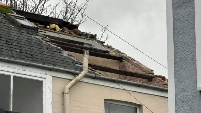 A large section of roof was blown off