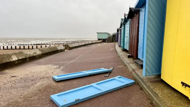 In Frinton-on-Sea on the Essex coast, the doors of a beach hut blows off