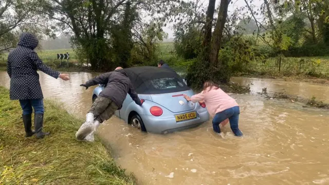 Amanda pushing her beetle