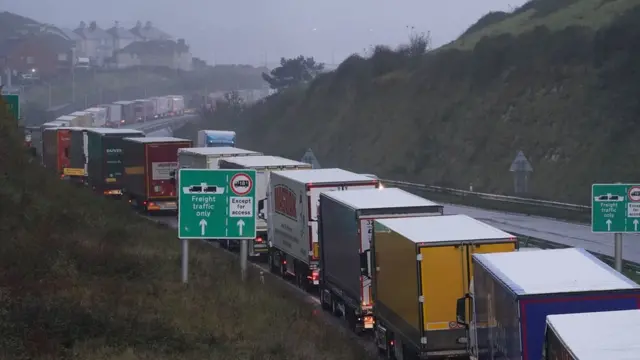 Queues of lorries in the rain