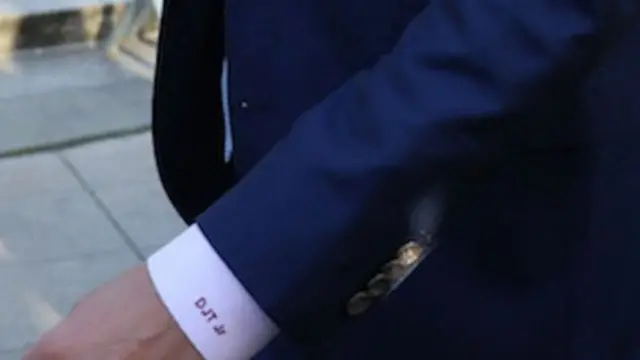 Donald Trump Jr's shirt has his initials "DJT Jr"