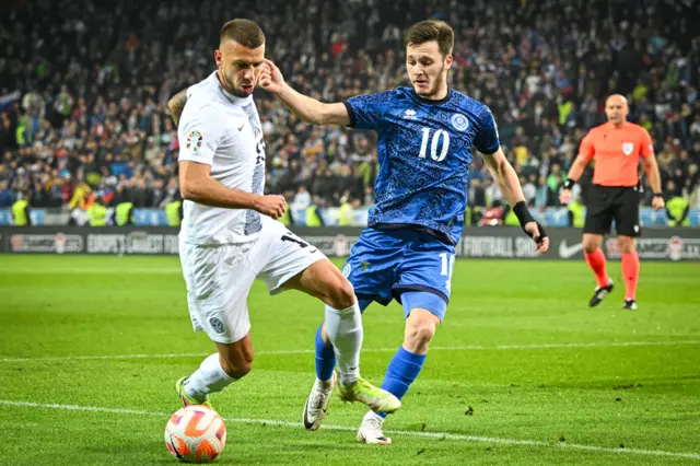 Slovenia's Jan Mlakar (left) with Kazakhstan's Maxim Samorodov.