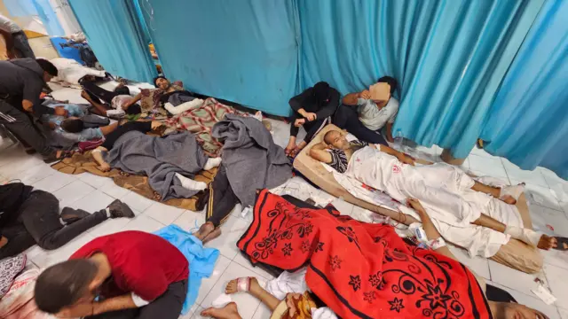 Patients on mattreses and blankets on the floor at the Indonesian Hospital in Gaza