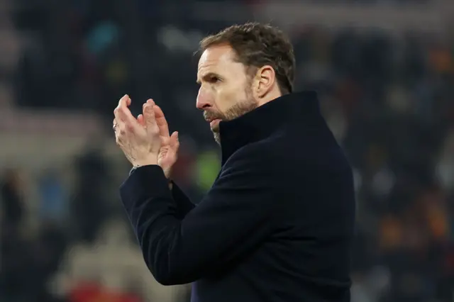 Gareth Southgate applauds the travelling fans.