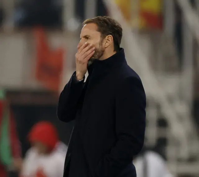 Southgate wipes his face in frustration as he watches on the touchline.