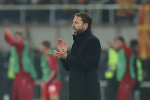 Southgate applauds from the sideline.