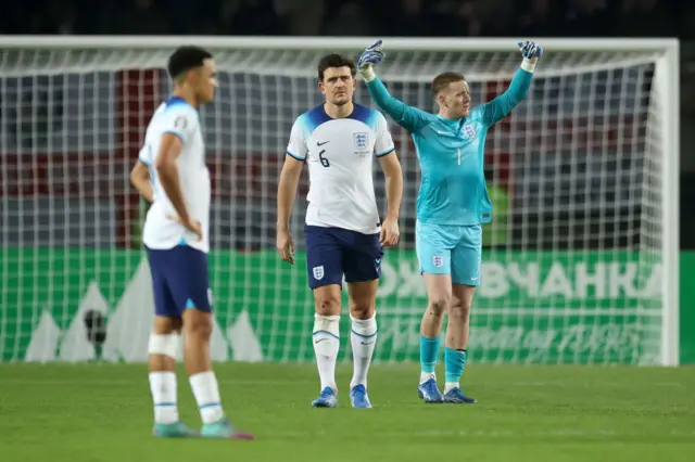 England players stand stunned after going behind.