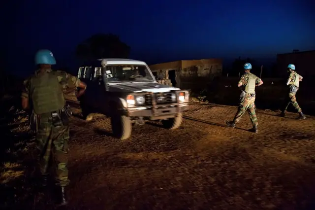 Peacekeeper troops from Ethiopia and deployed in the United Nations (UN) Interim Security Force for Abyei (UNISFA) patrol at night in Abyei town, Abyei state, on December 14, 2016.