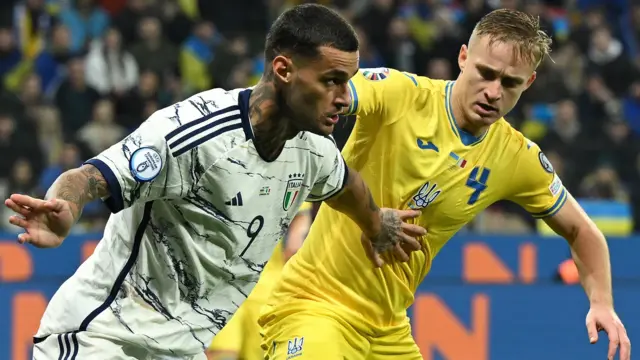 Gianluca Scamacca of Italy competes for the ball with Artem Dovbyk of Ukraine