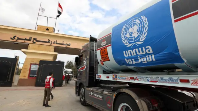 A fuel truck sporting an Unrwa flag sticker drives through the Rafah border crossing