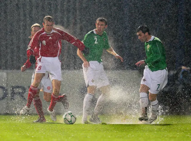 Gareth McAuley and Keith Gillespie in the rain