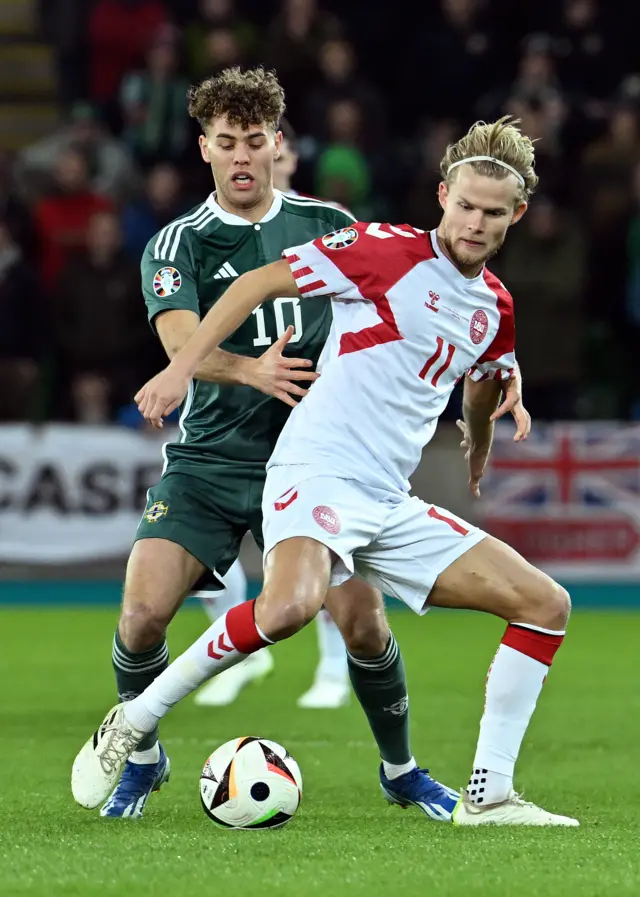 Northern Ireland's Dion Charles battles with Denmark's Morten Hjulmand in Belfast