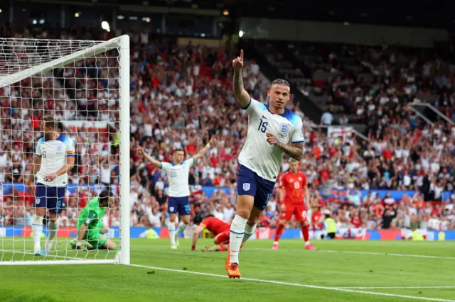 Kalvin Phillips celebrates scoring his first england goal by running away and holding up his hand.