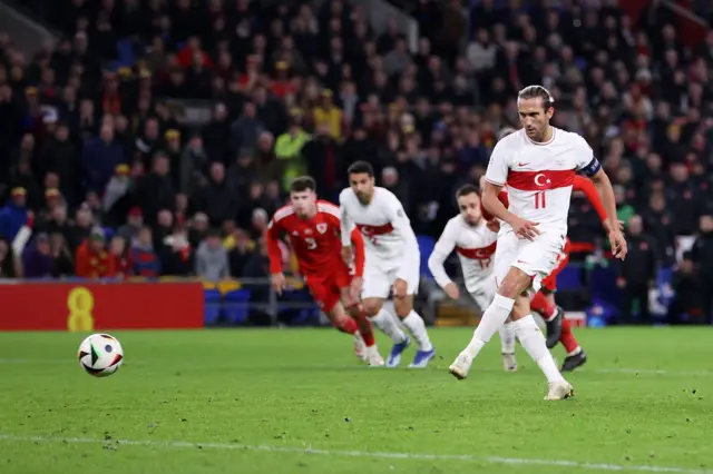 Yusuf YazIci of Turkey scores from the spot