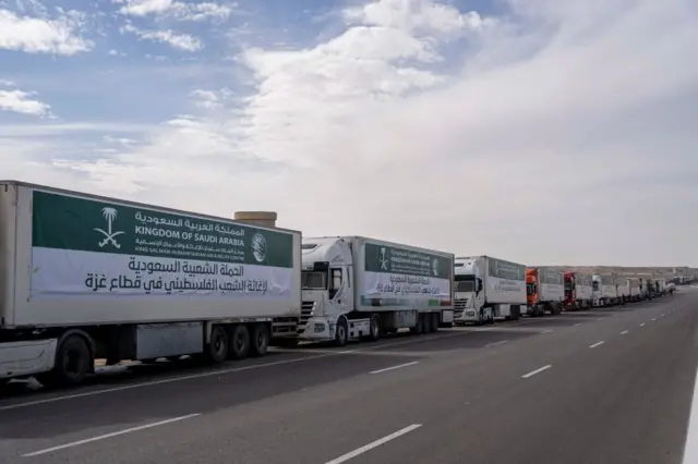 Lorries carrying aid queue on the Rafah border crossing