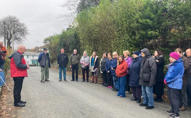 People gathered for a minute's silence