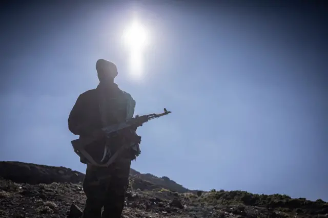 An Amhara militiaman looks on in Mehal Meda, Ethiopia, on December 06, 2021.