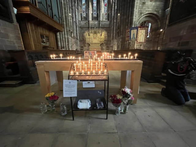 Candles lit in a church hall