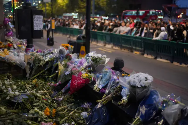 Flowers left outside the Whitgift shopping centre in Croydon, south London, ahead of a vigil for Elianne Andam