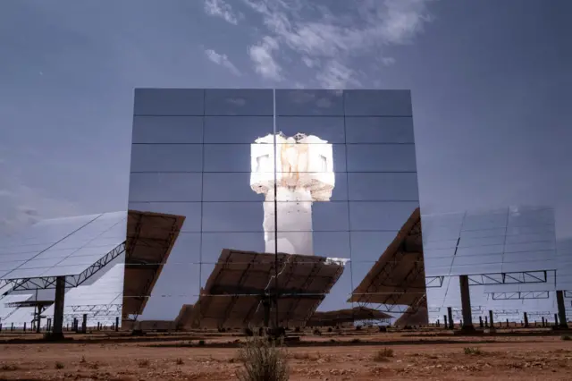 The main tower is reflected in heliostats at the KHI Solar One plant operated by Coxabengoa in Upington on November 21, 2023