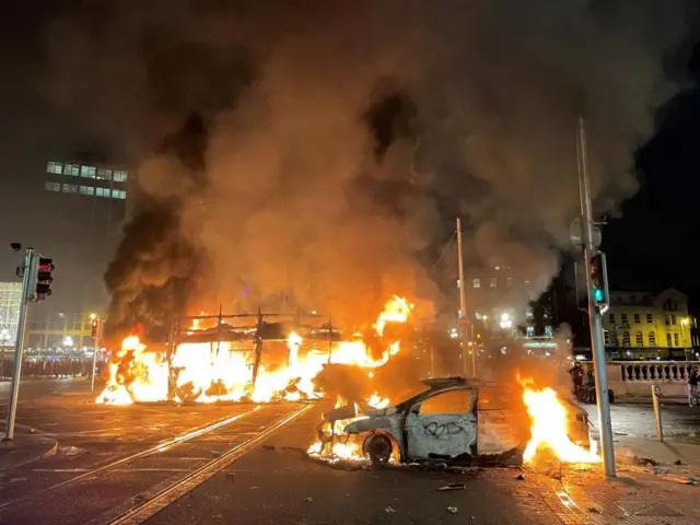 Vehicles burning on a bridge in Dublin