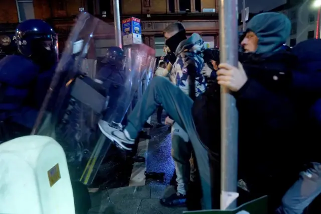 Riot police clashing with people in Dublin