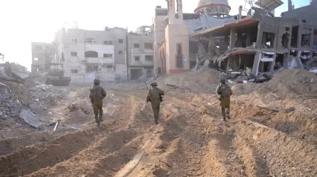 Israeli officers operate in Gaza on Thursday