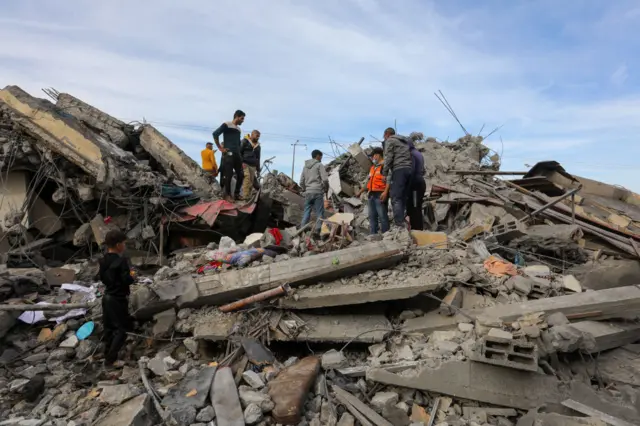 People search the rubble for survivors