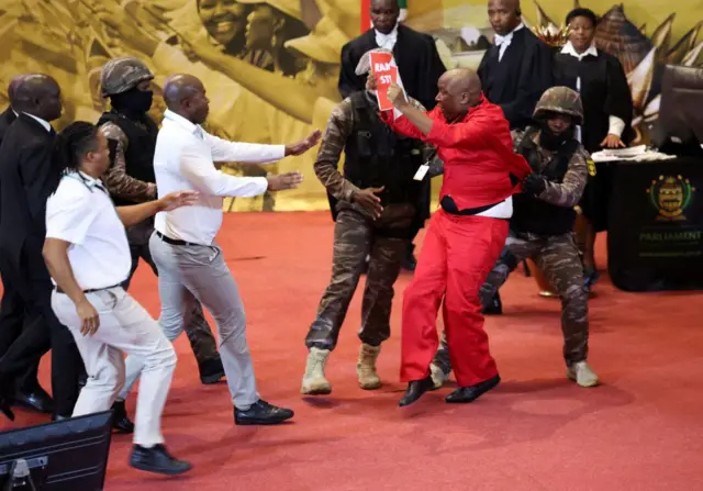 Opposition Economic Freedom Fighters party leader Julius Malema is removed by presidential task force as South African President Cyril Ramaphosa attempts to deliver his 2023 state-of-the-nation address (SONA) at the Cape Town City Hall in Cape Town on February 9, 2023.