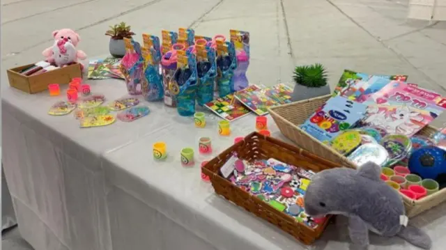 Selection of brightly coloured toys on a table