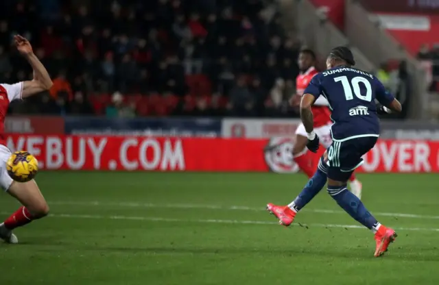 Leeds United's Crysencio Summerville (right) scores their side's first goal of the game during the Sky Bet Championship match at the AESSEAL New York Stadium, Rotherham