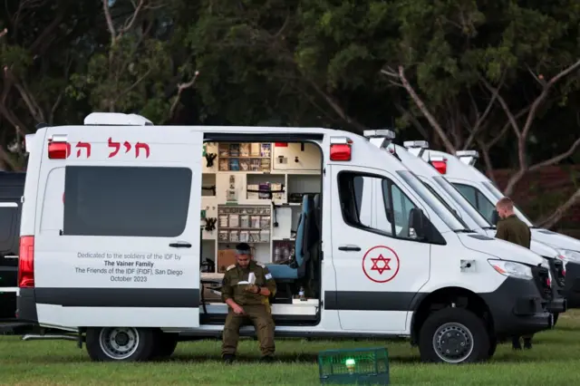 An ambulance worker waits at Schneider Medical Center in Petah Tikva