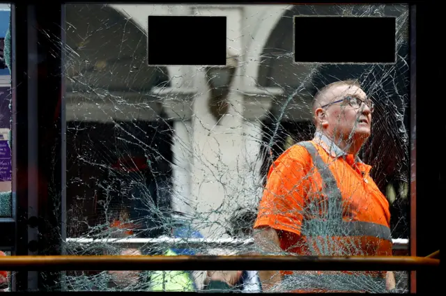 A worker inspects a damaged tram in Dublin