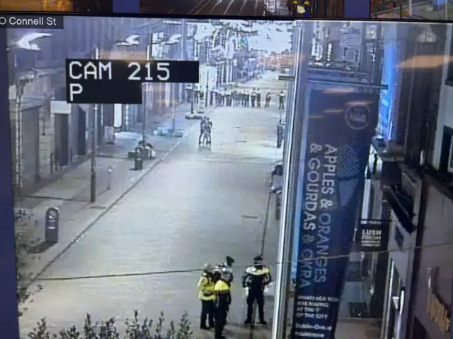 Quiet street with some police officers standing