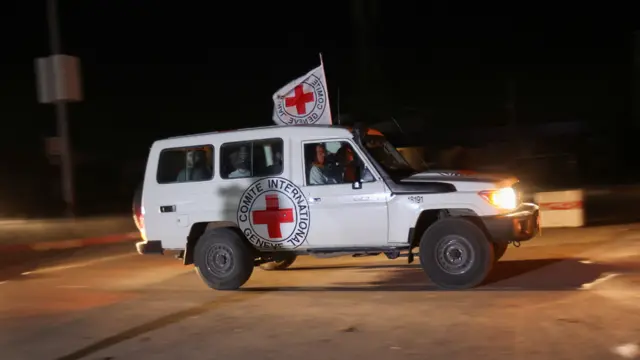 A Red Cross vehicle, which is part of a convoy arrives at the Rafah border crossing, amid a hostages-prisoners swap deal between Hamas and Israel, in the southern Gaza Strip November 24, 2023.